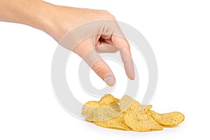 Tasty corrugated chips in hand isolated on white background, potato chips, unhealthy food, many fat and calories