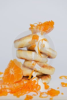 Tasty cottage cheese pancakes with citrus, orange and lemon, isolated on pure white background.