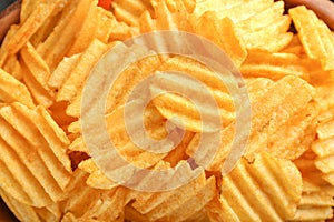 Tasty crispy potato chips, closeup