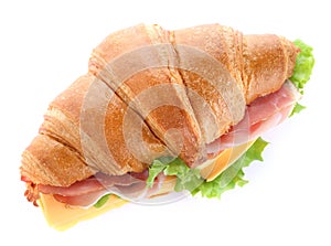 Tasty croissant sandwich with ham and cheese isolated on white
