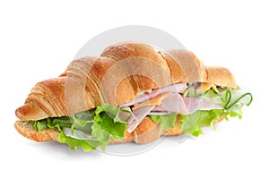 Tasty croissant sandwich with ham and cucumber on isolated