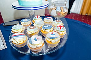 tasty cupcakes for thematic sea birthday party with sugar mastic waves and ship