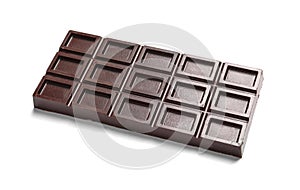 Tasty dark chocolate bar on white