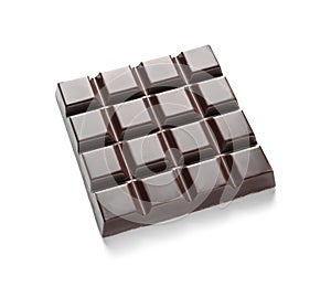 Tasty dark chocolate bar on white