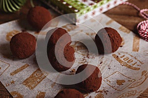 Tasty dark chocolate truffles with avocado with cocoa dusting