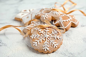 Tasty decorated Christmas cookies with ribbon