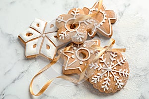 Tasty decorated Christmas cookies with ribbon