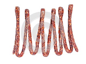 Tasty delicious dried bundle red sausages, salami is isolated on