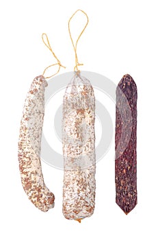 Tasty delicious dried white and red sausages, salami is isolated