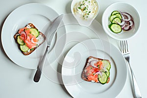 tasty diet food for breakfast or brunch - avocado and salmon toast with cream cheese