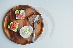 tasty diet food for breakfast or brunch - avocado and salmon toast with cream cheese