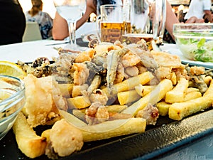 Tasty dish of fried fish, with chips