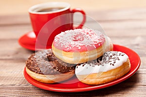 Tasty donut with a cup of coffee