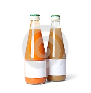 Tasty drinks in bottles with blank labels on white background