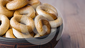 Tasty dry bagels sushki in bowl, closeup
