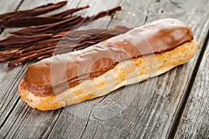 Tasty eclair with chocolate cream