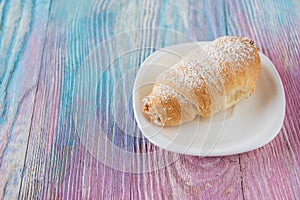 Tasty eclair on plate