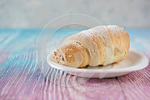 Tasty eclair on plate