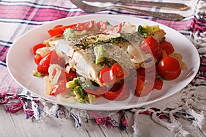 Tasty flounder with seasonal vegetables close-up. horizontal