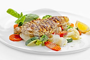 Tasty food. Grilled chicken breasts and vegetables . High quality image