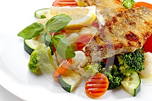 A Tasty food . Grilled fish and vegetables. High quality image