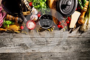 Tasty fresh appetizing italian food ingredients on old rustic wooden background. Ready to cook. Home Italian Healthy Food Cooking