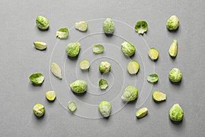 Tasty fresh Brussels sprouts on grey background