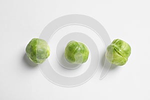 Tasty fresh Brussels sprouts on white, top view