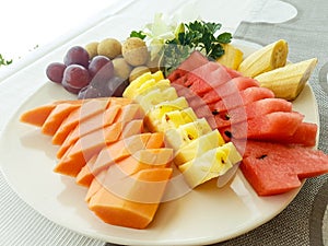Tasty fresh fruit served in a plate. photo