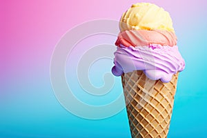 Tasty fresh fruity triple ice cream cone with cotton candy ice cream over a multicolored pastel background. Top view