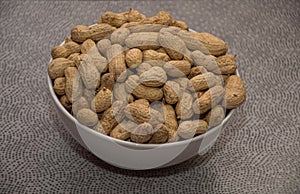 Tasty peanuts in shell textured background