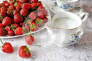 Tasty fresh strawberry with milk sour cream or yogurt closeup, dessert with strawberries
