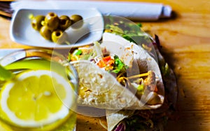 Tasty fresh wrap sandwich with meat, vegetables and cheese, deli