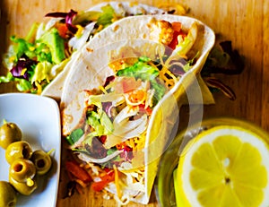 Tasty fresh wrap sandwich with meat, vegetables and cheese, deli