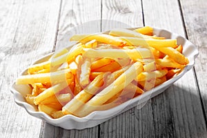 Tasty Fried Potato French Fries on White Plate