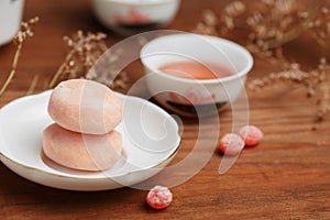 Tasty fruit mochi cakes in white porcelain saucer with chinese c