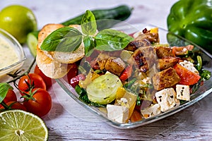 Tasty Greek salad on plate laid on table, Greek national dish