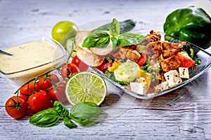 Tasty Greek salad on plate laid on table, Greek national dish