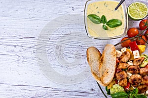 Tasty Greek salad on plate laid on table, Greek national dish