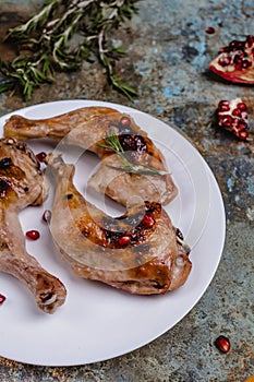 tasty grilled chicken legs with pomegranade seeds