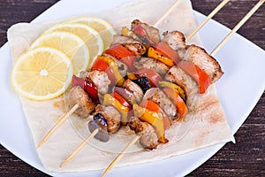 Tasty grilled meat and vegetables on skewer