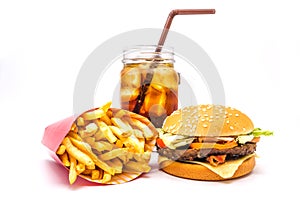 Tasty hamburger, French fries and cola isolated on white background.