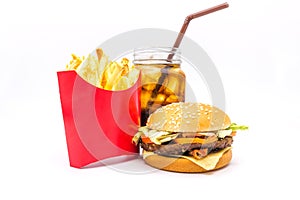 Tasty hamburger, French fries and cola isolated on white background.