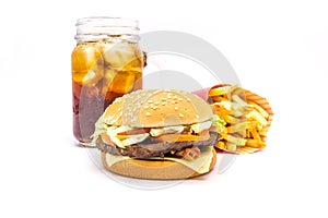 Tasty hamburger, French fries and cola isolated on white background.