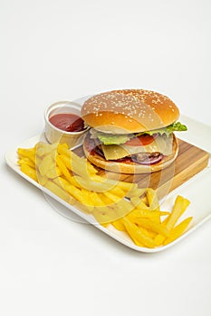 Tasty Hamburger and tasty french fries  on white background