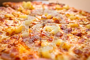 Tasty hawaiian pizza with ham and pineapple