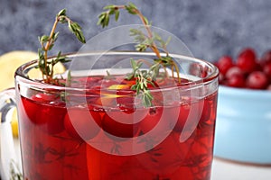 Tasty and healthy cranberry juice cranberry mors with thyme and lemon, a good drink to strengthen the immune system