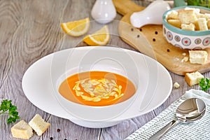 Tasty and healthy dietary food. Pumpkin soup cream on a white