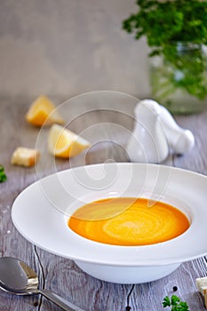 Tasty and healthy dietary food. Pumpkin soup cream on a white