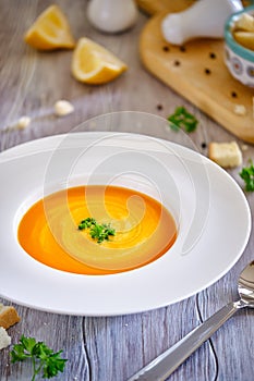 Tasty and healthy dietary food. Pumpkin soup cream on a white